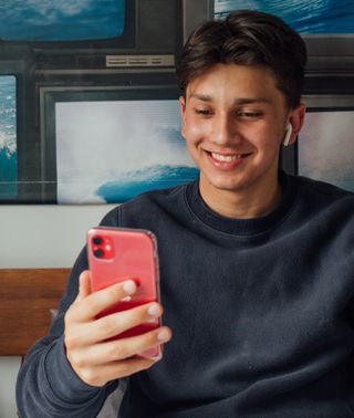 Teenage boy looking at phone