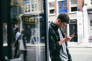 Teenage boy looking at phone